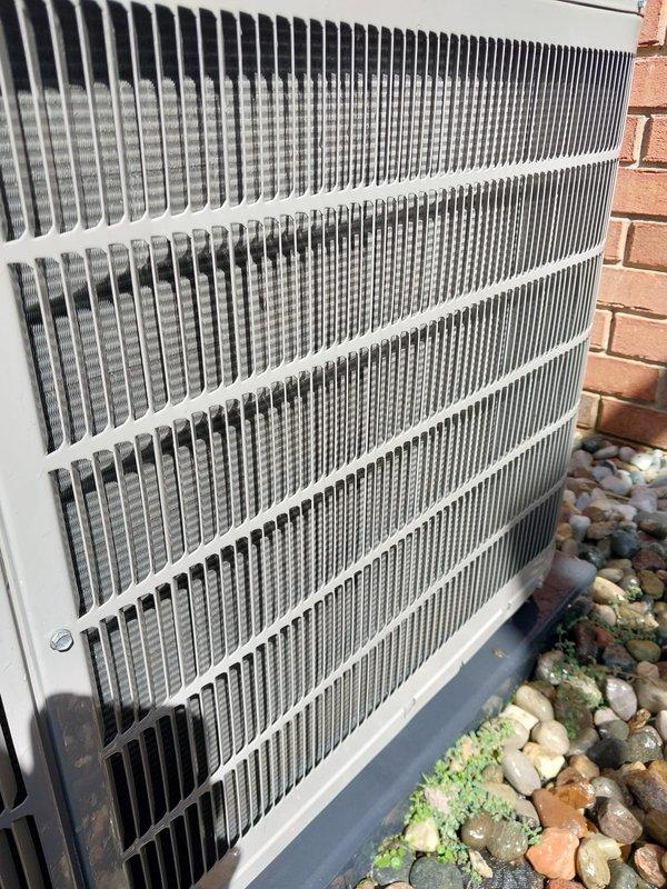 Completed routine A/C maintenance inspection on outdoor condensing unit, including visual assessment of heat exchanger coil fins and overall system condition. Unit was found to be operating within normal parameters with coils in clean condition and no immediate service concerns identified.