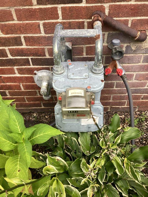 Completed electrical estimate for installation of new standby generator system with capacity range of 12,000-15,000 watts. Evaluated existing natural gas meter location and condition on exterior brick wall, confirming adequate gas supply infrastructure with accessible shutoff valves for generator tie-in. Assessed main electrical panel capacity and available breaker positions to accommodate automatic transfer switch integration. Documented site conditions including utility access points and proposed generator placement area. Provided comprehensive estimate covering generator unit, automatic transfer switch, gas line extension, electrical connections, and required permits for complete turnkey installation.
