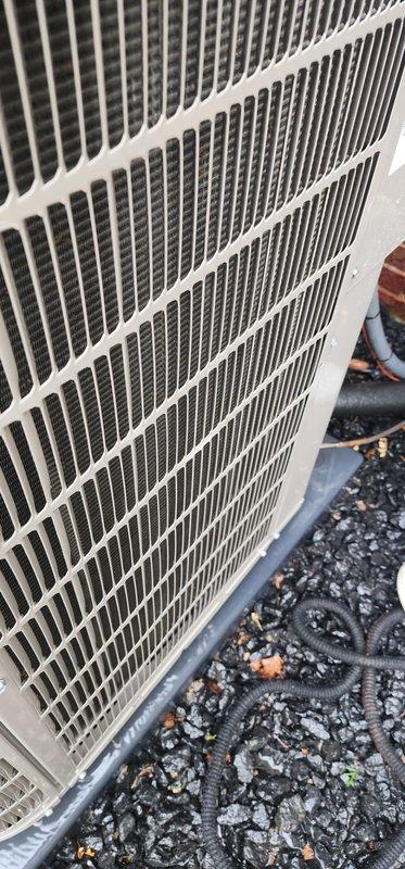 Completed scheduled preventive maintenance on residential air conditioning system under Worry Free Service Agreement. Inspected outdoor condenser unit, noting dirt and debris accumulation on heat exchanger coil fins requiring attention for optimal heat transfer efficiency. Examined indoor condensate drain pan, which displayed significant sediment buildup, water staining, and accumulated particulate matter indicating need for cleaning to prevent potential drainage issues and maintain proper system operation.
