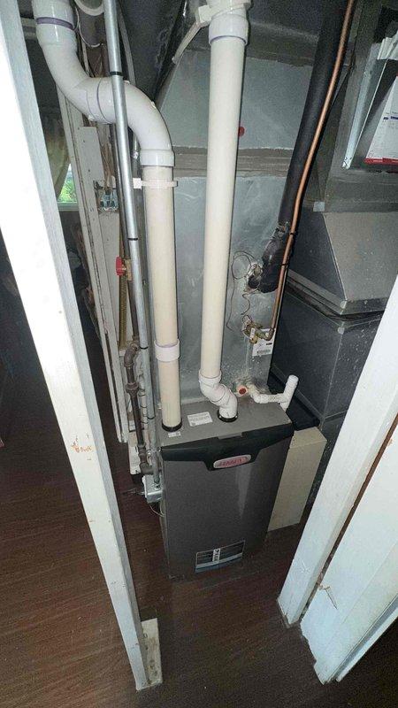 Responded to service call for noisy condensate pump at condominium unit. Upon arrival, inspected residential HVAC system located in utility closet, including furnace unit, PVC condensate drainage system, and associated refrigerant lines. Diagnosed issue with condensate pump operation, performed necessary repairs to eliminate noise concern, and verified proper system function before departure.