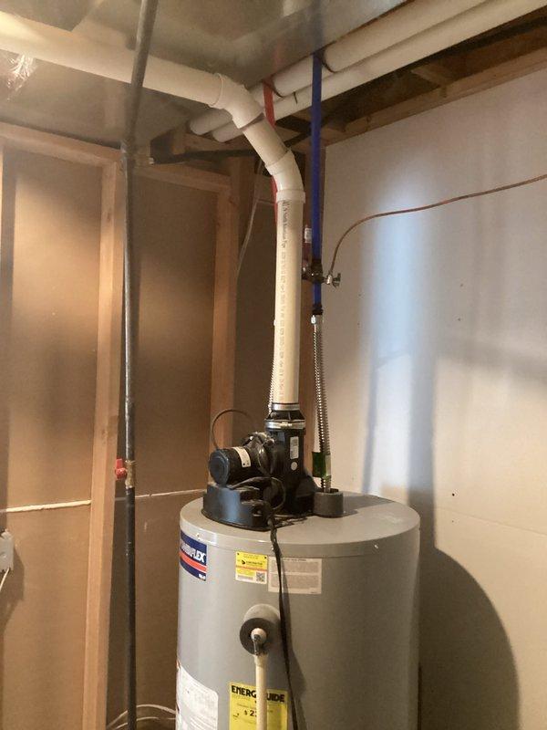 Completed HVAC estimate for air conditioning system replacement at residential property. Assessed existing basement utility room configuration, documented current water heater and plumbing infrastructure to determine optimal placement and clearance requirements for new AC equipment installation. Photographed utility space layout including exposed framing, electrical connections, and existing mechanical systems to develop comprehensive replacement plan and ensure proper sizing for new HVAC unit.