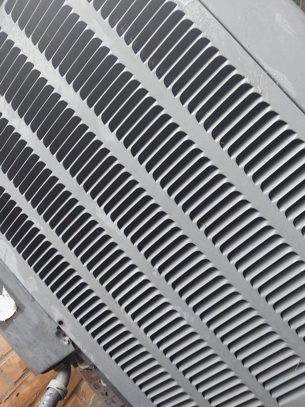 Completed comprehensive AC tune-up on 16-year-old outdoor condensing unit as part of prepaid maintenance plan. Upon inspection, discovered evaporator coil with severe ice buildup and standing water with rust accumulation in drain pan, indicating restricted airflow or refrigerant issue. Cleaned and inspected air return grille, checked all electrical connections, tested system operation, and addressed freezing condition to restore proper cooling function.