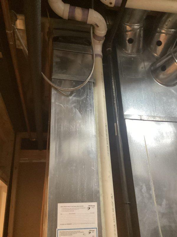 Provided comprehensive estimate for full HVAC system replacement of 22-year-old equipment currently located in basement utility area. Existing system includes natural gas furnace with air handler, humidifier unit, dual exhaust venting, and PVC condensate drainage, all components remain operational but have reached end of expected service life. Documented current installation configuration including ductwork connections, venting arrangement, and mechanical room layout to prepare accurate replacement specifications for comfort advisor consultation.