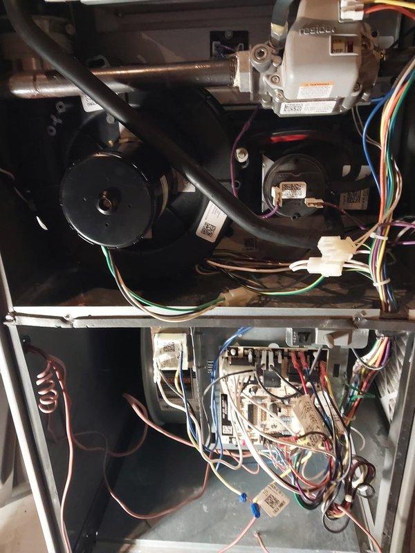 Completed annual maintenance tune-up on 5-year-old Lennox furnace located in basement. Performed comprehensive inspection of all system components including blower motor assembly, heat exchanger, burners, ignition system, and electrical controls. Verified proper operation of all safety switches, tested gas pressure, inspected flue and venting system including PVC condensate drain lines. Checked all electrical connections, control board functionality, and wiring harnesses. Examined blower motor and wheel, lubricated where applicable, and confirmed proper airflow. Inspected copper refrigerant lines and verified secure connections throughout cabinet. System operating within manufacturer specifications with no issues found. Unit left in excellent working condition.