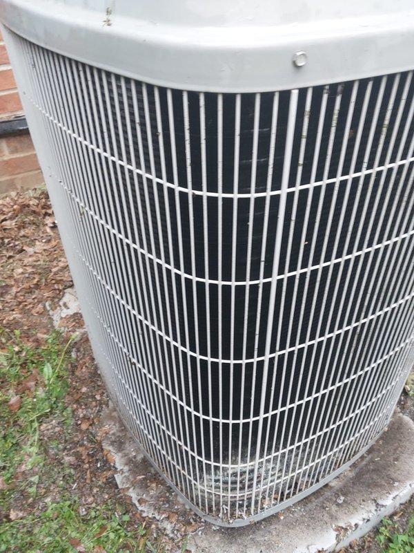 Completed scheduled combined AC and furnace maintenance as part of prepaid maintenance plan with customer-requested after 4 PM arrival. Performed comprehensive AC tune-up on outdoor cylindrical condenser unit positioned on concrete pad adjacent to building. Inspected vertical grille fins, protective top cover, and overall unit condition—no visible damage or unusual conditions noted. Proceeded to basement to service furnace system and inspect air handler components. Observed normal moisture accumulation on blower motor assembly and metal housing, consistent with typical condensation during cooling operation. Inspected coil assembly, heat exchanger tubes, and protective wire cage—all components operating within normal parameters. Documented equipment condition through photographs for maintenance records. No issues identified during inspection; both systems functioning properly with no reported customer concerns.