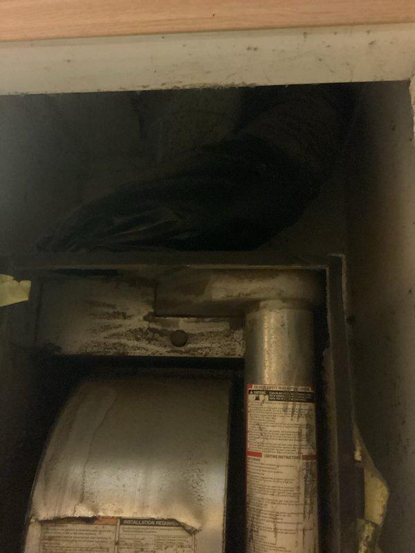Provided estimate for complete HVAC system replacement including outdoor condensing unit and indoor furnace. Existing equipment is non-operational with age unknown; outdoor unit shows significant weathering and corrosion on exterior surfaces, while indoor gas furnace exhibits dust accumulation and signs of age in confined utility space. Recommended full system replacement to restore heating and cooling functionality.