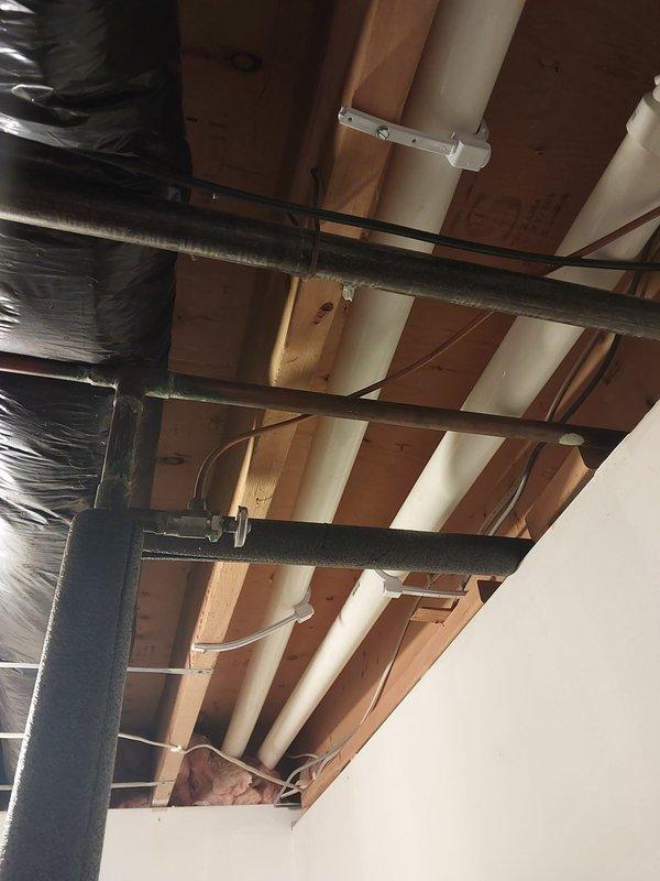 Responded to warranty call for failed mechanical inspection due to improper PVC pipe support. Installed three missing pipe hangers on horizontal PVC condensate drain lines to meet code requirement of support spacing at 4-foot intervals. Documented completed work with photographs per warranty protocol and submitted required follow-up documentation.