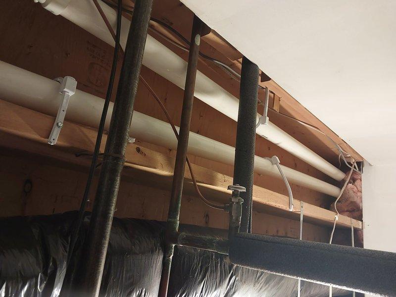 Responded to warranty call for failed mechanical inspection due to improper PVC pipe support. Installed three missing pipe hangers on horizontal PVC condensate drain lines to meet code requirement of support spacing at 4-foot intervals. Documented completed work with photographs per warranty protocol and submitted required follow-up documentation.