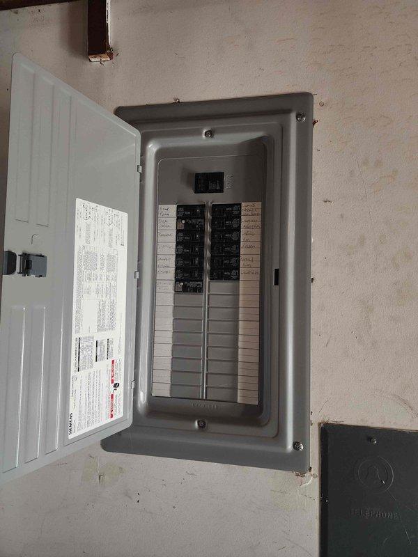 Performed site evaluation for installation of exterior 3-prong outlet to accommodate portable generator connection. Inspected existing electrical panel and exterior utility area to assess circuit availability and determine optimal routing for new outdoor receptacle. Documented current electrical service configuration including main panel with dual breaker rows and exterior meter bank setup. Provided complimentary estimate for installation of weather-resistant GFCI-protected outlet with appropriate amperage rating for generator use, including necessary conduit run from panel to exterior mounting location.