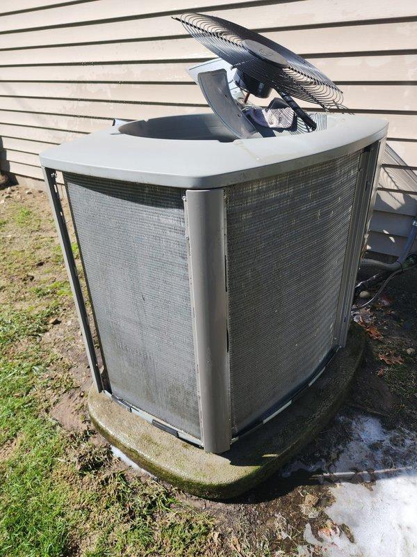Completed scheduled AC maintenance on residential split system. Performed inspection of outdoor condenser unit, noting normal weathering and minor debris accumulation around base and on mesh grilles. Verified condenser coils, fan assembly, and housing integrity. Inspected indoor air handler components including evaporator coil, condensate drain pan assembly, and pump system. All equipment found operating within normal parameters with standard wear consistent with regular use.