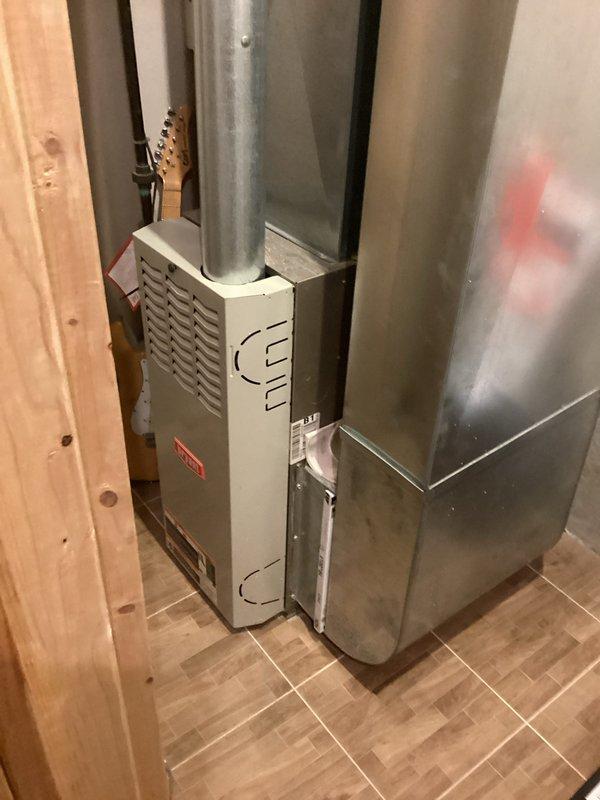 Assessed 24-year-old secondary heating system and identified cracked heat exchanger requiring immediate replacement due to safety concerns. Provided comprehensive estimate for new furnace installation including removal of existing unit, proper venting, and integration with current ductwork system in basement utility area.