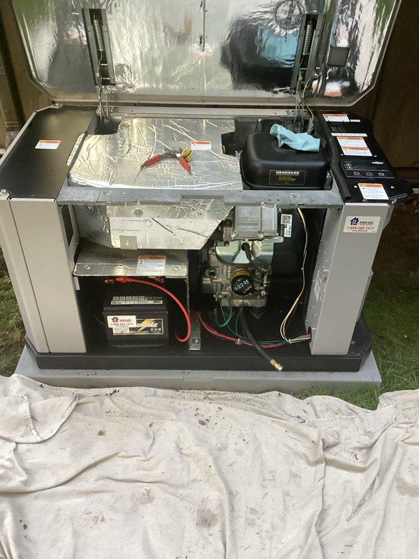 Performed routine maintenance on residential HVAC system, including inspection of internal components, gas valve assembly, and blower motor bearings. Technician accessed interior compartments, examined wiring connections and control units, and serviced mechanical components to ensure proper system operation.