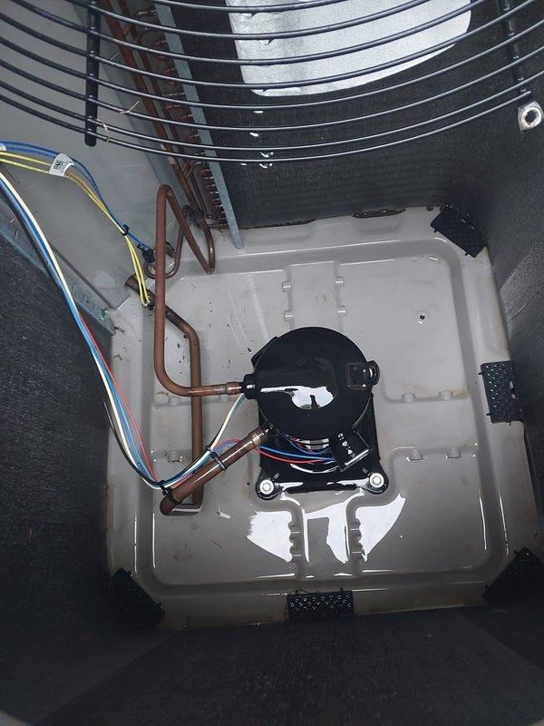 Completed scheduled air conditioning maintenance on residential cooling system. Performed comprehensive inspection of condenser unit including compressor, refrigerant lines, electrical connections, and fan assembly. All copper refrigerant lines inspected and found secure with proper connections. Verified compressor operation and mounting integrity. Cleaned condenser coil fins and protective grille, ensuring unrestricted airflow through louvers and mesh screening. Checked all electrical wiring connections for proper termination and secure routing. Inspected drain pan for proper drainage and cleared minor debris accumulation. Verified fan guard condition and security. System tested and confirmed operational. Customer advised that furnace maintenance contract requires renewal for continued service coverage.