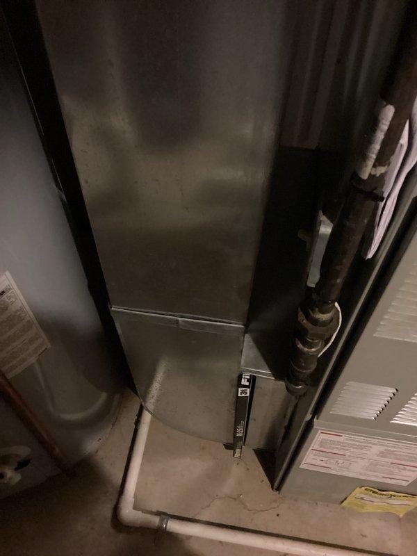Conducted comprehensive evaluation of non-functional HVAC system with 30-year-old furnace and air conditioning unit, along with 13-year-old water heater. Identified failed AC disconnect box as immediate cause of air conditioning failure and assessed overall system condition for full replacement estimate. Documented existing Trane furnace installation, refrigerant line configuration, and venting system to provide accurate specifications for complete HVAC system and water heater replacement options.