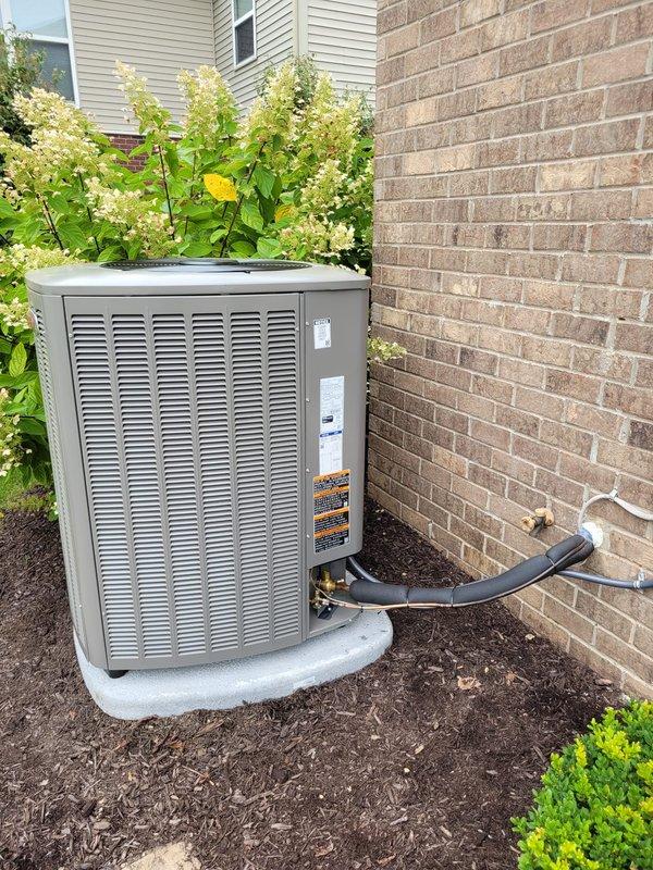 Completed full HVAC system installation including Lennox furnace with air handler, outdoor air conditioning condenser unit, Lennox S40 smart thermostat, and 50-gallon water heater. Reconnected existing UV air purification system to new equipment and verified all components operational. System installed in basement utility area with outdoor condenser positioned on concrete pad, all refrigerant lines properly insulated and routed through exterior wall, electrical connections completed to code, and financing documentation finalized.