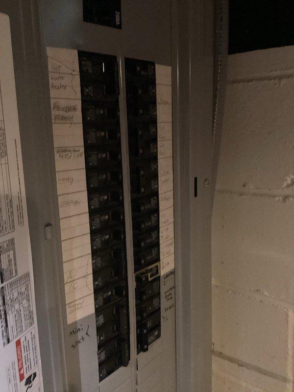 Conducted comprehensive electrical site assessment for backup generator installation. Photographed and documented existing 200-amp main electrical panel configuration, including current circuit breaker layout and all labeled circuits serving critical loads such as HVAC system, hot water heater, furnace, and various branch circuits throughout the residence. Evaluated panel capacity and available breaker spaces to determine optimal integration point for automatic transfer switch. Documented existing circuit identification labels to assess essential circuits requiring backup power during utility outages. Inspection confirmed panel accessibility and adequate clearance for generator tie-in work in unfinished utility area.