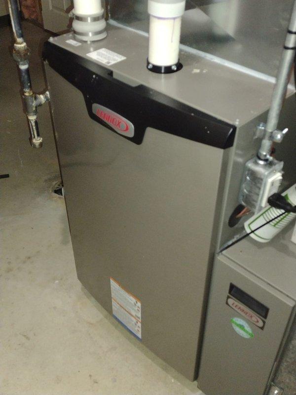 Completed comprehensive heating system tune-up and maintenance on residential furnace unit. System was operational upon arrival and confirmed to be working properly. Performed thorough inspection of all internal components including gas valve, draft inducer motor, blower assembly, and control board. Verified all electrical connections, tested safety controls, and inspected heat exchanger. Checked and confirmed proper operation of venting system with dual PVC exhaust pipes. All components found to be in good working condition with no deficiencies noted. System left in proper operating condition.