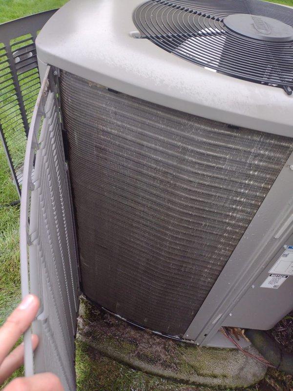# HVAC Maintenance - Prepaid Visit

Completed comprehensive preventive maintenance on residential air conditioning system during scheduled late afternoon appointment. Upon arrival, verified no active customer concerns or operational issues reported with the unit.

Performed complete AC tune-up service on outdoor condensing unit. Removed protective grille cover to access condenser coil assembly and internal components. Inspected evaporator coil fins, which showed moderate accumulation of dust, debris, and particulate matter consistent with normal system operation. Cleaned condenser coil fins to remove dirt, organic matter, and debris buildup that had collected on horizontal louvers and between fin spacing.

Examined heat exchanger assembly and structural mounting brackets for integrity and proper alignment. Verified all internal components were securely fastened and functioning within normal parameters. Inspected circular fan assembly and protective fan guard for damage or obstruction.
