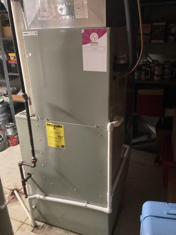 Conducted on-site evaluation of existing HVAC system for replacement estimate following previous contractor's recommendation that furnace required replacement. Assessed current equipment including gray metal air handler/furnace unit with Aprilaire humidifier attachment, evaluated refrigerant line connections, condensate drainage system with white PVC piping, and ductwork configuration in basement utility area. Documented existing system specifications and installation conditions to provide comprehensive replacement options.
