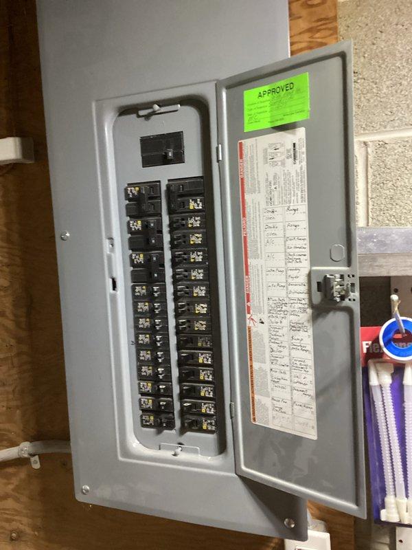 Conducted on-site evaluation for residential standby generator installation. Assessed existing electrical infrastructure including main service panel, meter location, and exterior mounting area on stone veneer facade. Documented current electrical panel configuration with dual column breaker arrangement and verified available capacity for generator integration. Identified optimal placement zone adjacent to utility meter on exterior wall for generator unit positioning and transfer switch installation.