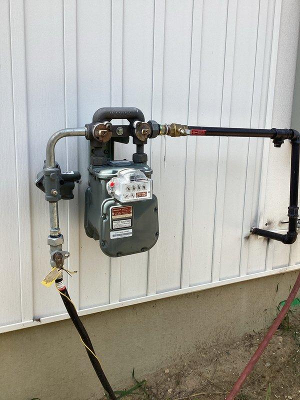 Conducted comprehensive site assessment for whole home generator installation. Evaluated existing 200-amp electrical service panel to determine compatibility and capacity for generator integration, documenting current breaker configuration and available connection points. Inspected natural gas meter assembly and fuel supply infrastructure, confirming adequate gas line sizing and pressure capacity to support standby generator operation. Provided detailed pricing estimate for complete installation including automatic transfer switch, generator pad preparation, electrical connections, and gas line modifications as required.