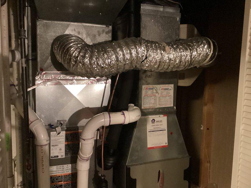 Completed full HVAC system replacement including outdoor condensing unit and indoor air handler with associated ductwork and condensate drainage system. Additionally installed new hot water heater in utility closet with proper venting and connections. All equipment positioned on gravel pad, electrical connections verified, refrigerant lines installed, and system tested for proper operation before customer acceptance.