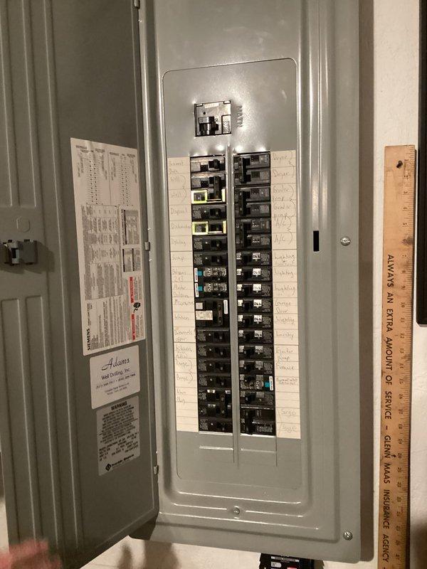 Provided estimate for replacement of 22-year-old furnace with failed heat exchanger. Unit is non-operational and located in basement utility area with existing electrical panel and ductwork infrastructure. Assessed current natural gas furnace installation, documented existing equipment configuration including vertical ductwork and electrical service for replacement specifications.
