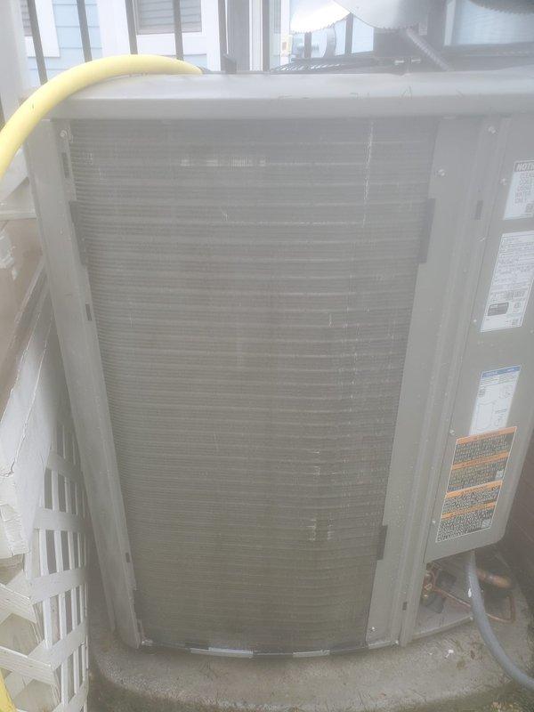 Completed scheduled prepaid air conditioning maintenance on residential split system. Performed comprehensive tune-up including inspection of outdoor condenser unit, verified refrigerant line connections and electrical components at air handler, cleaned condenser coils which showed dust and debris accumulation, and confirmed system operational status with no deficiencies noted.