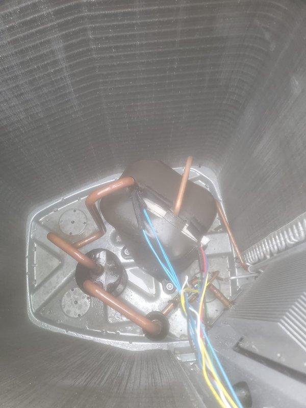 Completed scheduled prepaid air conditioning maintenance on residential split system. Performed comprehensive tune-up including inspection of outdoor condenser unit, verified refrigerant line connections and electrical components at air handler, cleaned condenser coils which showed dust and debris accumulation, and confirmed system operational status with no deficiencies noted.