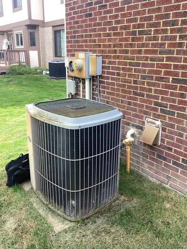 Provided comprehensive estimate for complete HVAC system replacement including furnace, air conditioning unit, and hot water heater for 30-year-old equipment. Assessed existing basement-mounted furnace showing significant age and dust accumulation, along with outdoor cylindrical AC unit positioned on concrete pad against brick exterior. Documented current system configuration including ductwork connections, electrical components, and gas line setup to prepare detailed replacement proposal for full system upgrade.