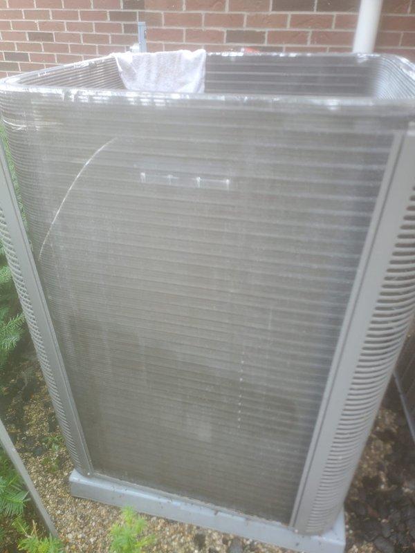 Completed scheduled cooling maintenance on residential air conditioning system. Performed comprehensive inspection of outdoor condenser unit and indoor evaporator components, documenting system condition through photographic records. Verified proper operation of compressor, condenser coils, and drainage system, with unit showing normal operational wear and minor debris accumulation on exterior fins requiring routine attention during maintenance visit.