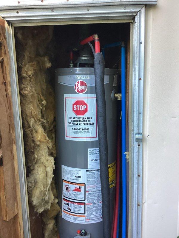 Completed on-site plumbing estimate for water heater replacement. Assessed existing Rheem Performance water heater installed in exterior utility closet, documented current installation including hot and cold water supply lines, pressure relief valve configuration, and venting system with dual exhaust pipes through roof. Photographed unit specifications, existing piping connections, compartment dimensions, and insulation conditions to provide accurate replacement proposal.