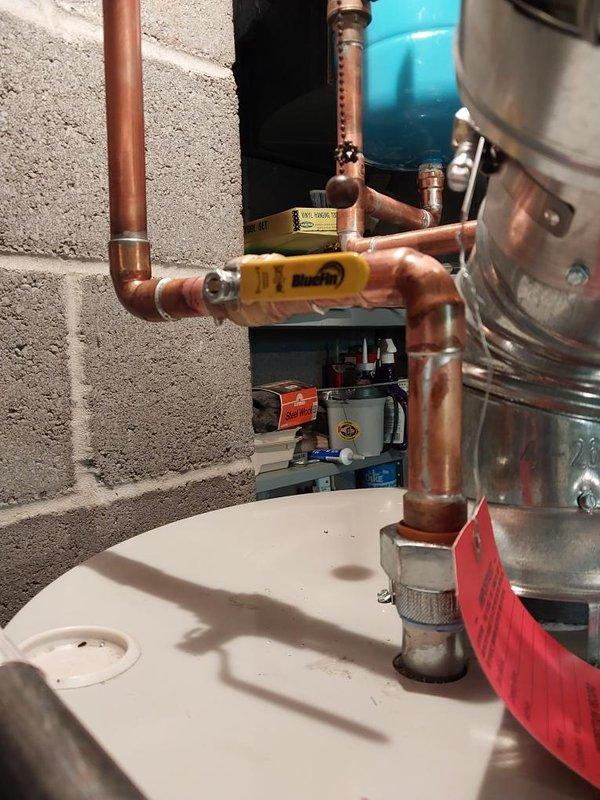 Responded to follow-up service call regarding odor issue on recently installed tanked water heater. Inspected complete installation including gas connections, copper supply lines, expansion tank, venting system, and drain pan assembly. Verified proper operation of gas valve, confirmed secure connections at all fittings, and assessed water heater functionality. All components including the Midco gas valve, pressure relief valve, and flexible vent ducting were operating within normal parameters. Scheduled Saturday appointment per customer request to address persistent odor concern and perform additional diagnostics if needed.