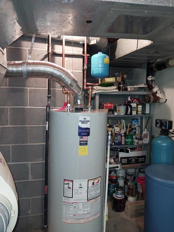 Responded to follow-up service call regarding odor issue on recently installed tanked water heater. Inspected complete installation including gas connections, copper supply lines, expansion tank, venting system, and drain pan assembly. Verified proper operation of gas valve, confirmed secure connections at all fittings, and assessed water heater functionality. All components including the Midco gas valve, pressure relief valve, and flexible vent ducting were operating within normal parameters. Scheduled Saturday appointment per customer request to address persistent odor concern and perform additional diagnostics if needed.
