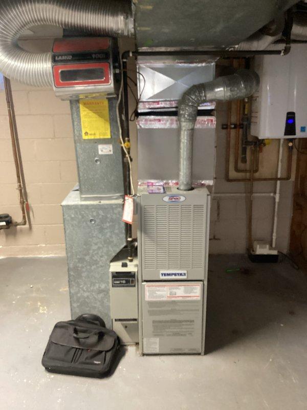 Conducted furnace inspection and identified cracked heat exchanger in Tempstar unit requiring immediate attention due to safety concerns. Documented existing HVAC system configuration including furnace, air handler with Lasko blower motor, ductwork, and associated plumbing connections, and prepared replacement estimate for homeowner review. Also provided repair estimate as requested for comparison of options.