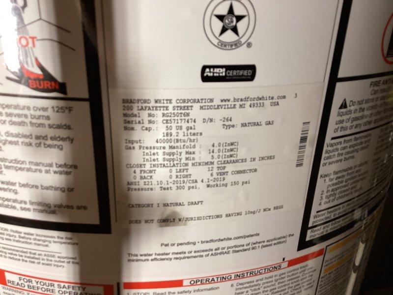Completed callback for water heater installation to address B-vent concerns. Verified proper installation of oval B-vent ductwork and elbow connections in attic space for Bradford White 50-gallon natural gas water heater (Model RG250T6N, 40,000 BTU/hr input). Inspected all vent connections, confirmed proper sealing and secure mounting of galvanized ductwork, and documented installation with photographs showing compliant venting system and unit specifications.