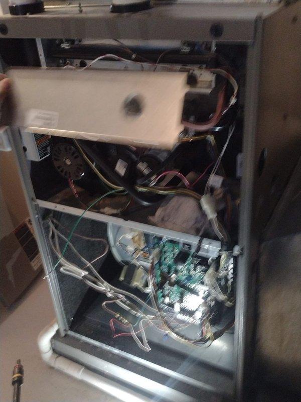 Completed comprehensive AC maintenance and tune-up on residential HVAC system. Performed full system inspection with access panel removal to examine internal components including blower motor assembly, control board, and electrical connections. Conducted combustion analysis using Testo 310II analyzer, which confirmed optimal system performance with 96.0% efficiency, stack temperature of 92°F, CO readings of 10 ppm, and CO2 levels at 6.96%. All measurements within manufacturer specifications and safety standards. System operating properly with no deficiencies noted.