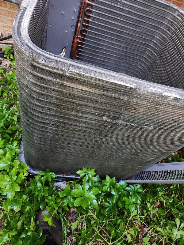 Completed scheduled cooling system maintenance on outdoor air conditioning condenser unit. Performed comprehensive inspection of compressor, refrigerant lines, and condenser coils, noting accumulation of dirt, debris, and environmental buildup on exterior fins and coil surfaces. Unit operational with all components functioning properly upon completion of routine preventive maintenance service.