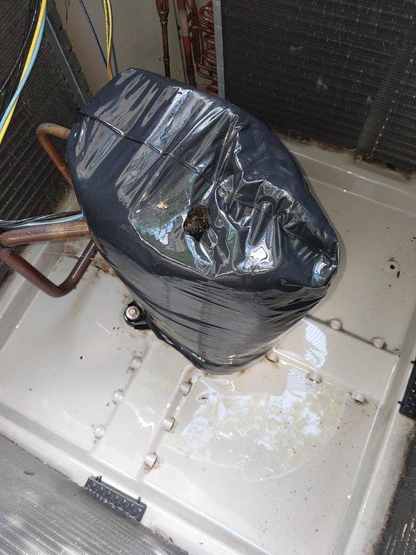 Completed comprehensive cooling system maintenance inspection on residential air conditioning unit. Verified evaporator coil condition showing clean, properly functioning fins with no debris accumulation or damage across all three sections of the heat exchanger assembly. Inspected condensing unit components including compressor, refrigerant lines, and drainage system, noting proper water evacuation through drain pan with no blockages present. All system components operating within normal parameters with no immediate service needs identified.