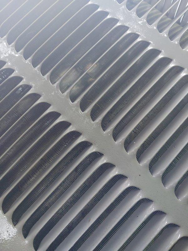 # HVAC Maintenance Service Completed

Performed scheduled air conditioning maintenance on residential cooling system. Upon arrival, confirmed customer concern regarding outdoor condensing unit settlement and conducted thorough inspection of equipment positioning and levelness. 

During system evaluation, identified significant frost accumulation on evaporator coil assembly, indicating restricted airflow or potential refrigerant charge issues. Documented heavy ice buildup on aluminum fin surfaces and serpentine coil patterns through photographic evidence. Inspected ductwork connections and mechanical fasteners in confined access areas, noting condensation present on system components.

Assessed outdoor unit foundation stability and measured degree of settlement. Evaluated structural support requirements and documented current positioning for lifting recommendations. Completed standard maintenance procedures including visual inspection of all accessible HVAC components, duct connections,