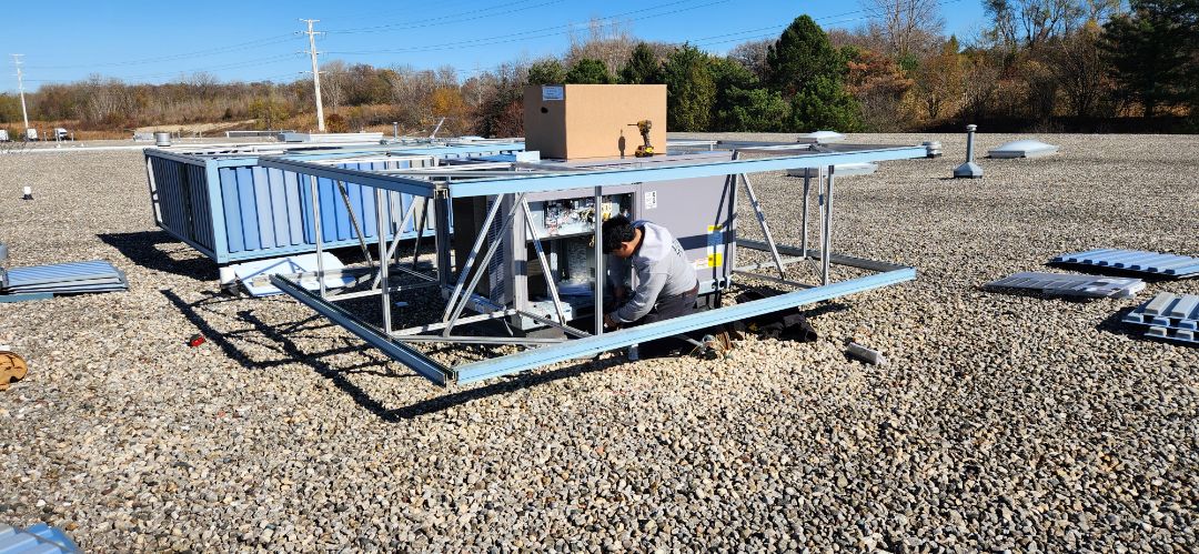 heating service installed a new Carrier rooftop unit compete with economizer and visual screening 