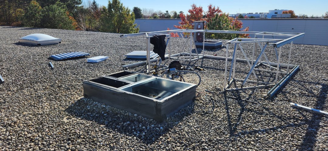 heating service installed a new Carrier rooftop unit compete with economizer and visual screening 