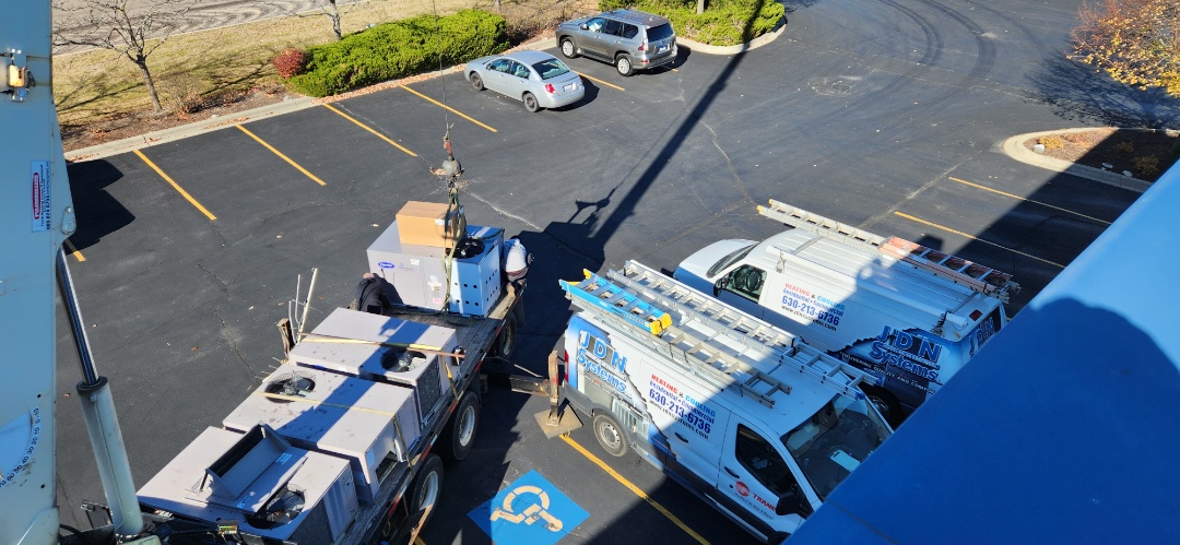 heating service installed a new Carrier rooftop unit compete with economizer and visual screening 