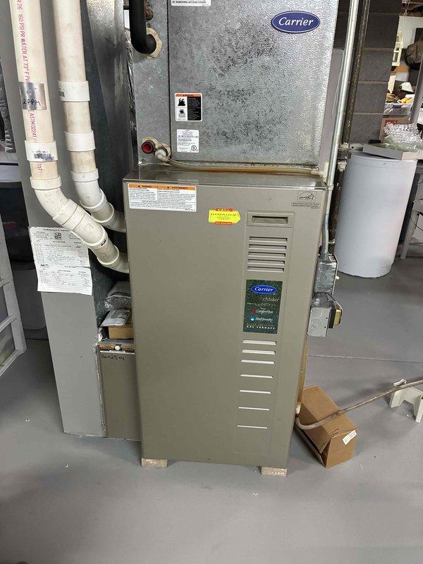 Performed semi-annual maintenance on Carrier gas furnace. Conducted temperature measurements with digital thermometer showing 118.0°F at supply vent. Inspected ventilation system including PVC exhaust pipes and connections. All components operating within normal parameters.