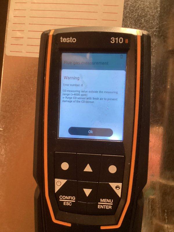Performed furnace tune-up and identified critical CO safety issue. Testo 310 II analyzer detected carbon monoxide levels exceeding 4000ppm measurement threshold, indicating potential combustion problems. Inspected internal wiring and blower assembly; recommended immediate repairs to address dangerous CO emissions.