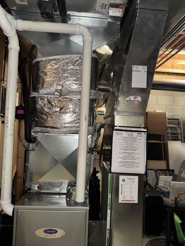 Responded to customer complaint of burning smell and smoke from 10-year-old Carrier furnace. Upon thorough inspection of the Carrier Infinity system, including blower components, motor housing, and ductwork, no evidence of smoke source or operational issues was detected. Visual inspection confirmed proper installation of all mechanical components and PVC venting system. No service actions required.