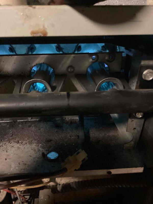 Performed sold repair service on furnace, replacing damaged burners and installing new blower motor capacitor. Combustion analysis with Testo 310 II confirmed proper operation with optimal efficiency (91.4%) and safe CO levels (1 ppm). System is now functioning correctly with all components operational.