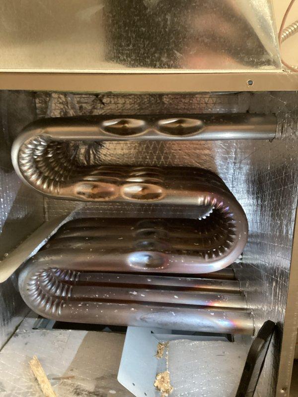 Performed annual preventative maintenance tune-up on Goodman direct vent forced air furnace (model HWCN4809P24A2A). Inspected heat exchanger and confirmed good condition with no signs of damage or corrosion. Addressed customer's filter questions and provided proper replacement guidance.