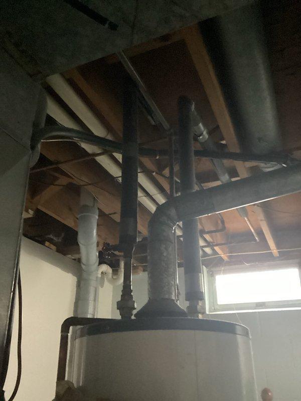 Completed annual membership tune-up on heating system. Inspected gas valve assembly, internal components, and water heater/tank unit. System functioning properly; installed T4 thermostat to replace previous unit.