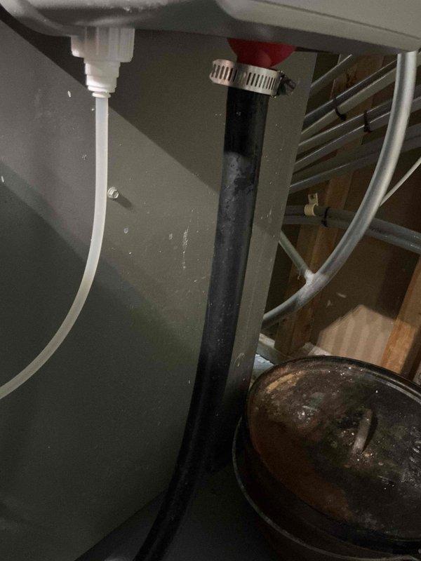 Responded to customer complaint of water leakage from furnace. Diagnosed issue as disconnected drain hose from steam humidifier. Reconnected the hose and secured it with a hose clamp to prevent future leakage.